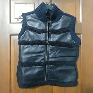 Black sweater/faux leather sleevless vest